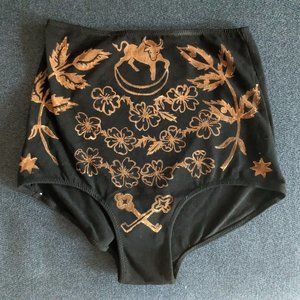 V. The Hierophant in Black: Briefs